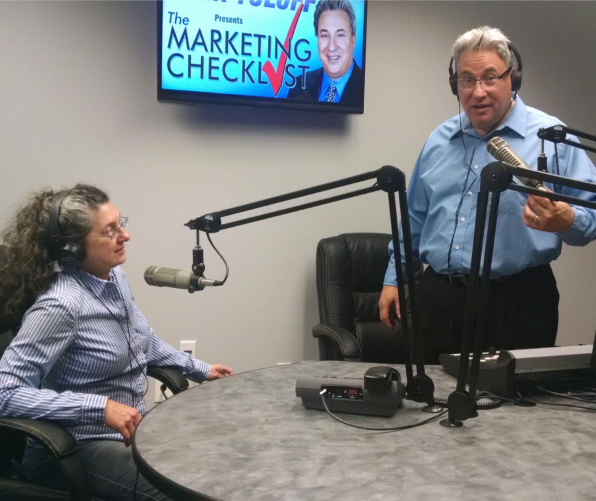 An image of the Yuloff's speaking in a webinar with a podcast style setup