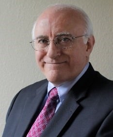 Headshot of George Scott - male wearing dark suit with red tie Headshot of George Scott - male wearing dark suit with red tie