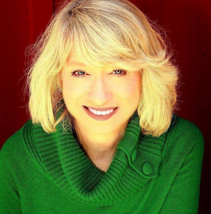 Mary Maas Headshot Headshot of Mary Maas wearing a green sweater