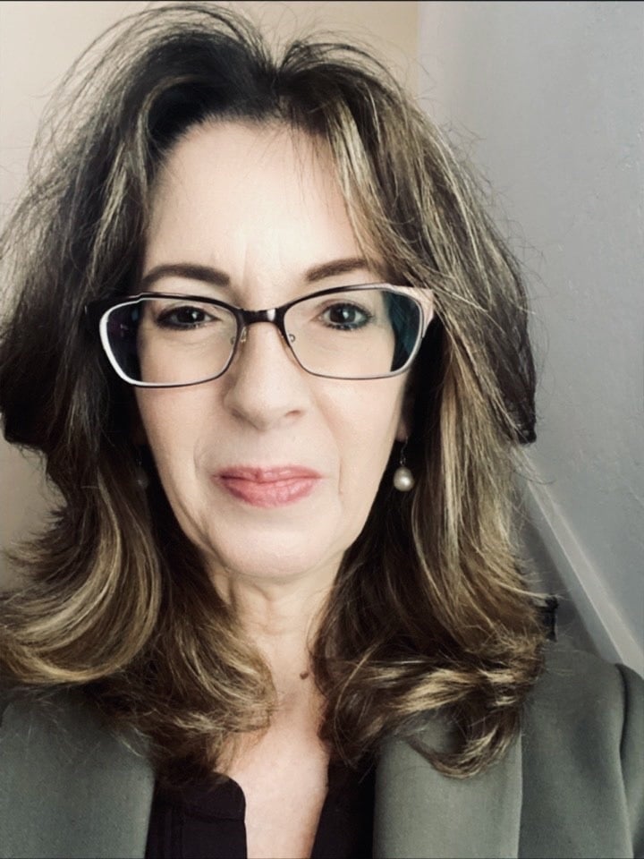 Headshot of Lisa Towles wearing glasses Headshot of Lisa Towles wearing glasses